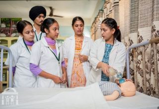 child-health-lab-resuscitator-instruction-gn-college-nursing-watermark