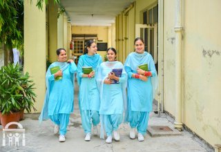 nursing-students-walking-campus-books-watermark