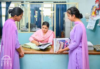 students-checking-out-book-nursing-college-library-watermark