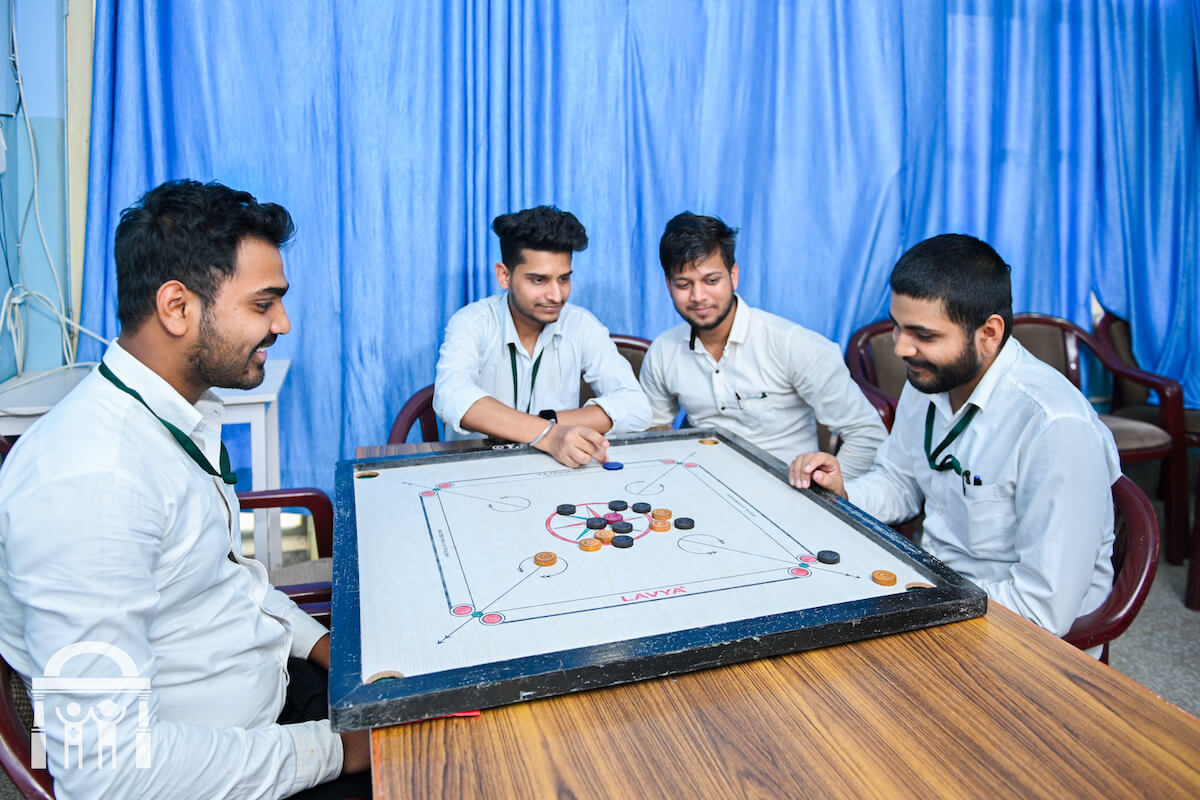 Male nursing students playing in the recreation room at Guru Nanak College of Nursing in Dhahan Kaleran